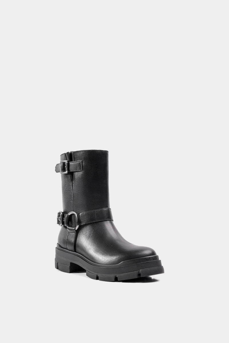 Bota de cuero negro con detalle de hebilla superior e inferior y tacón bajo robusto