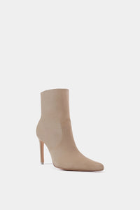 Botín femenino de tacón delgado y alto estilo sock boot en tejido beige con puntera puntiaguda