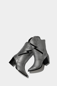 botas plateadas cowboy espacial